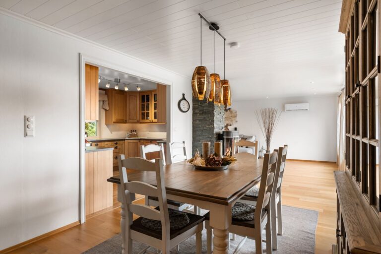 Mediterranean Pendant Lighting Over a Dining Table: Scale, Height, and Warm Materials